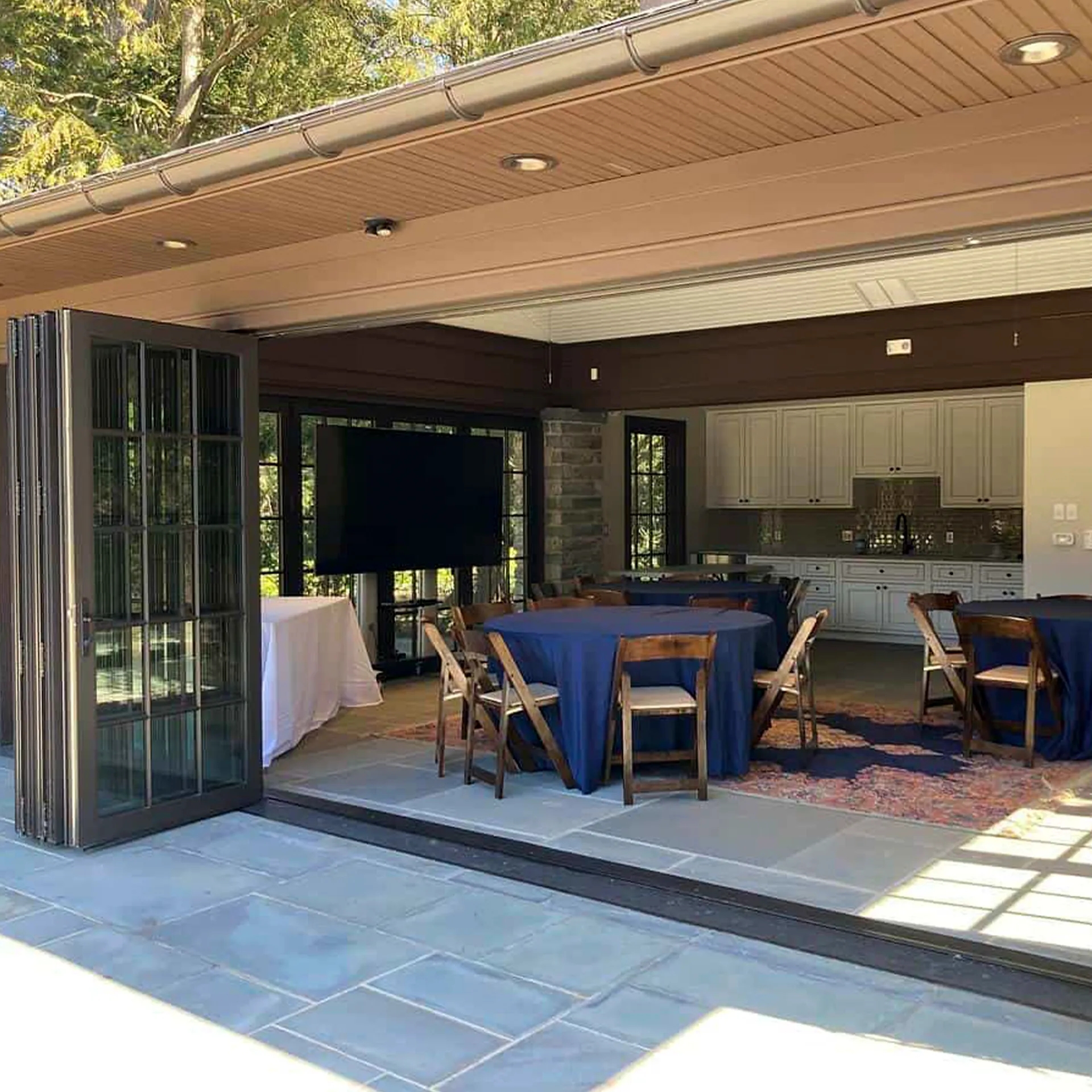 Photo by Samantha Nestory
 - The accordion doors open for an event at the Pool House.
