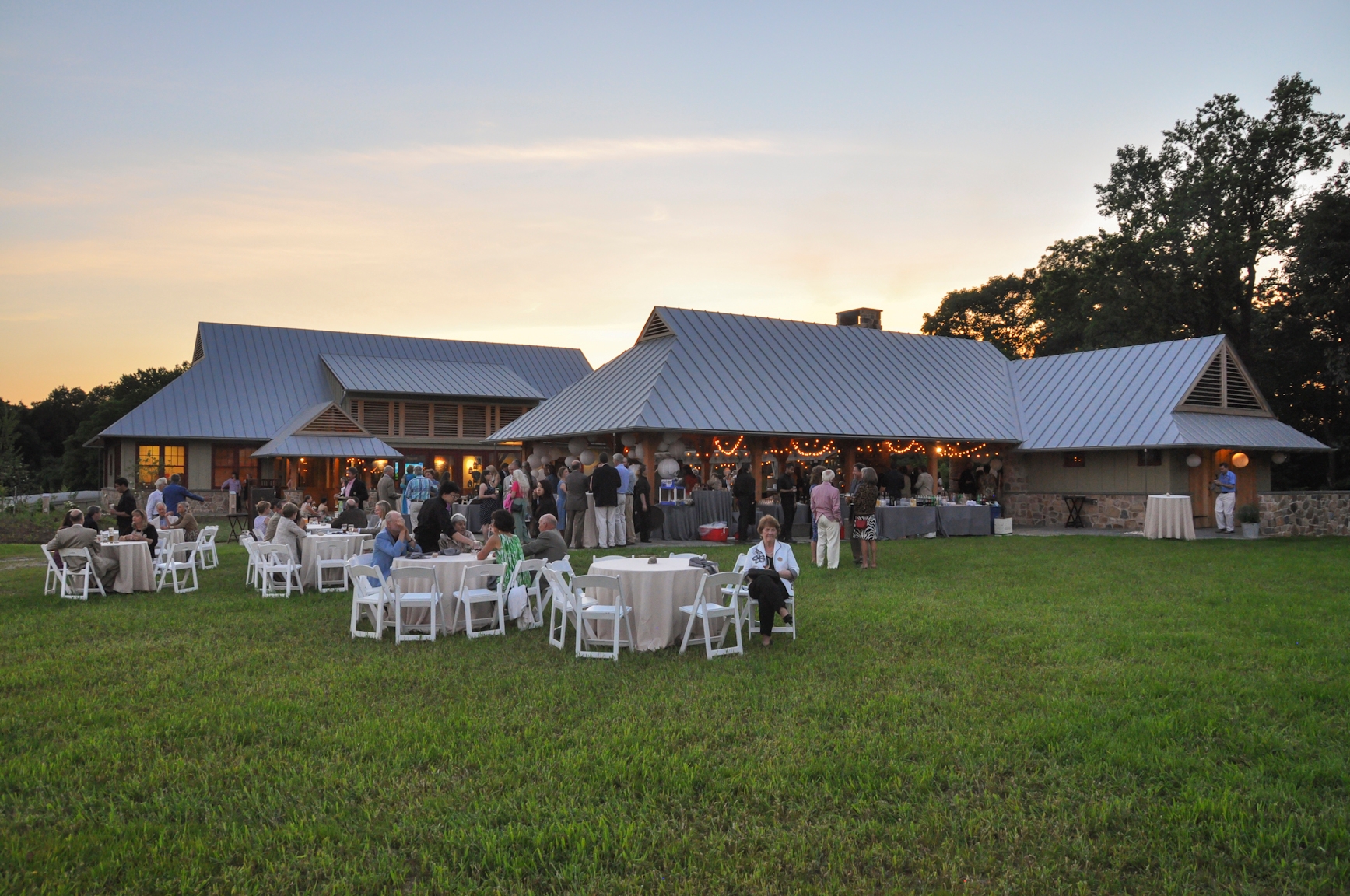 Photo by Jim Moffett
 - The pavilion and area outside of the Lenfest Center during an event in summer at ChesLen Preserve.
