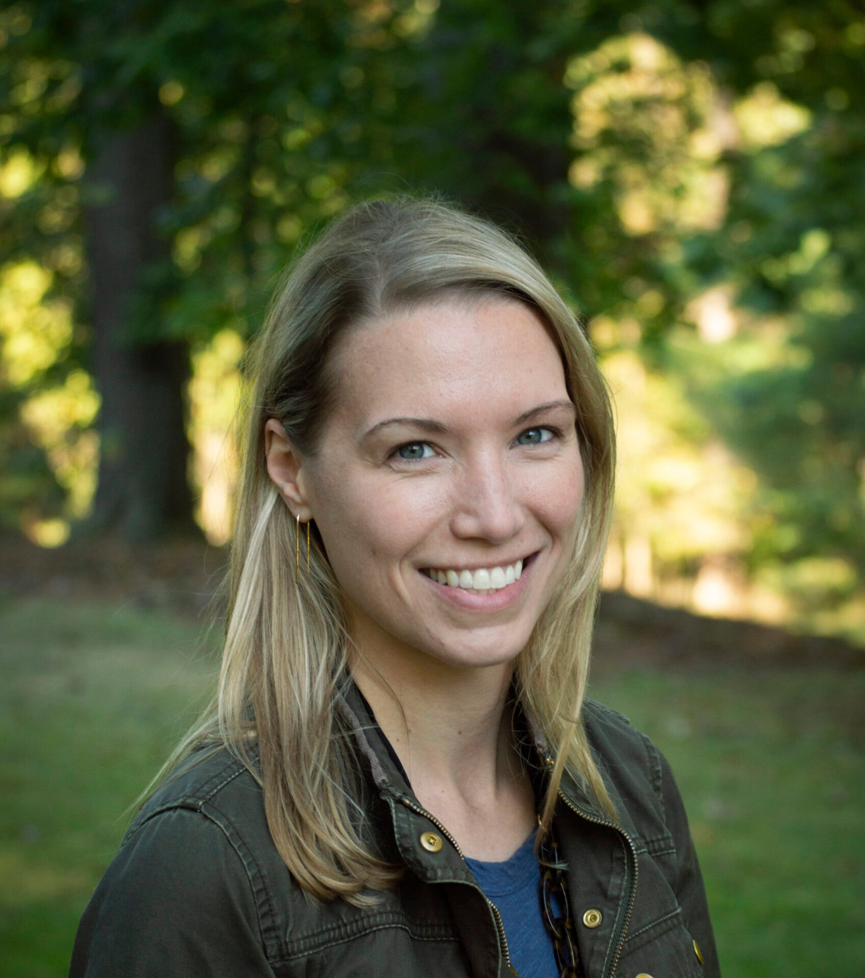 a woman with blond hair smiling