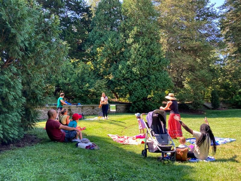 kids playing music in a circle garden