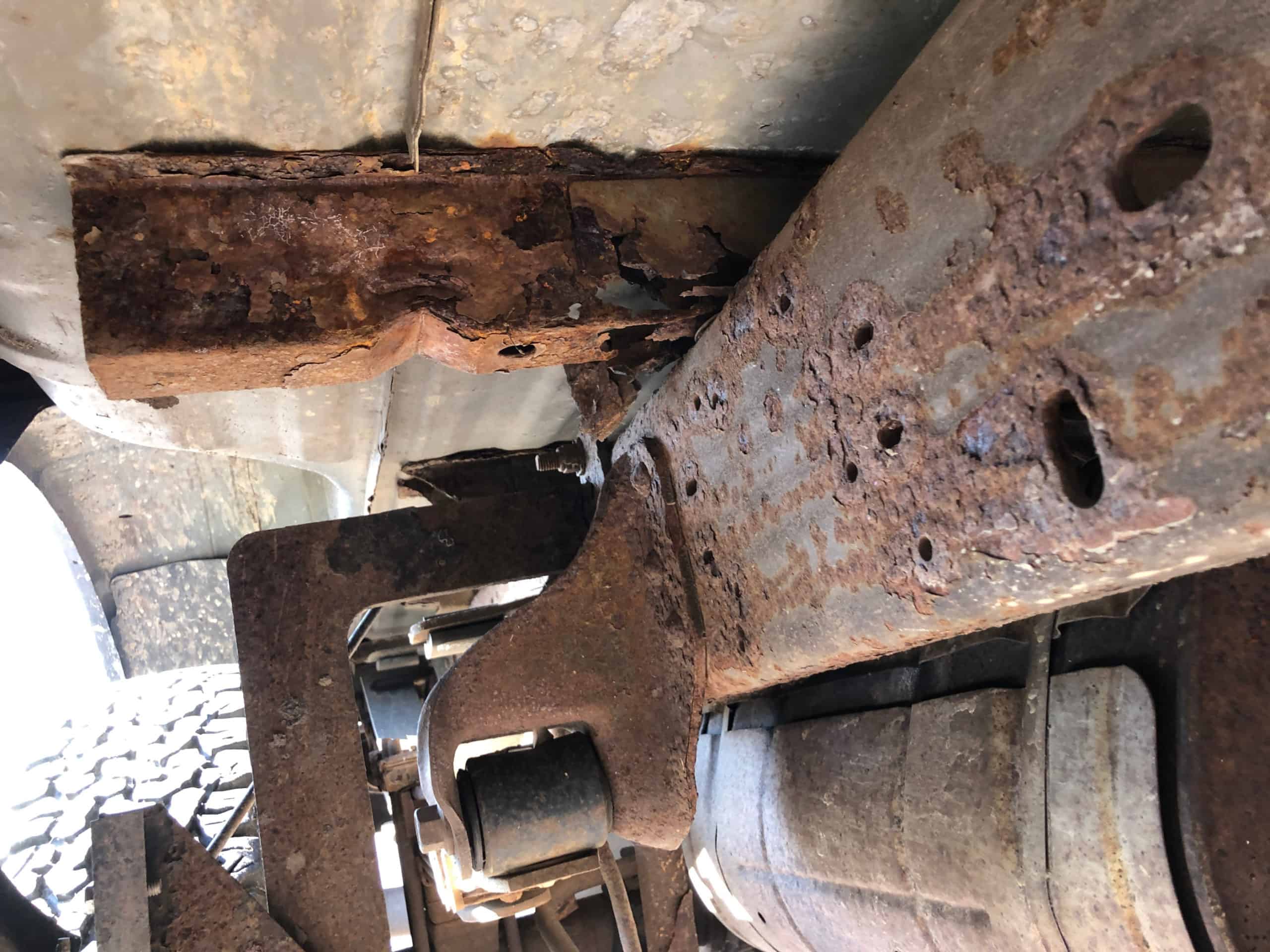 Rusty underside of old preserve work truck
