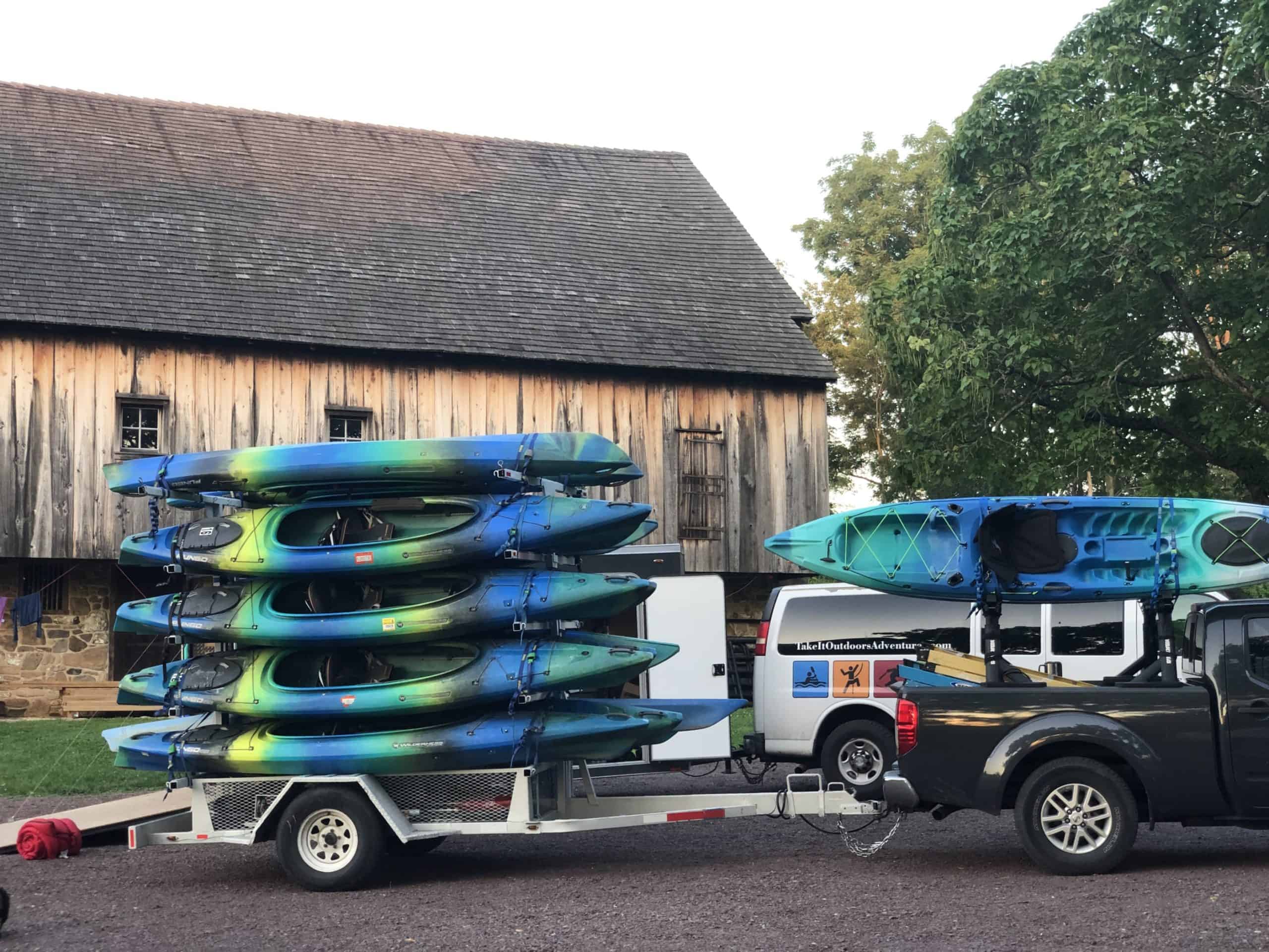Kayaks stacked five high on a trailer ready for the Schuylkill River