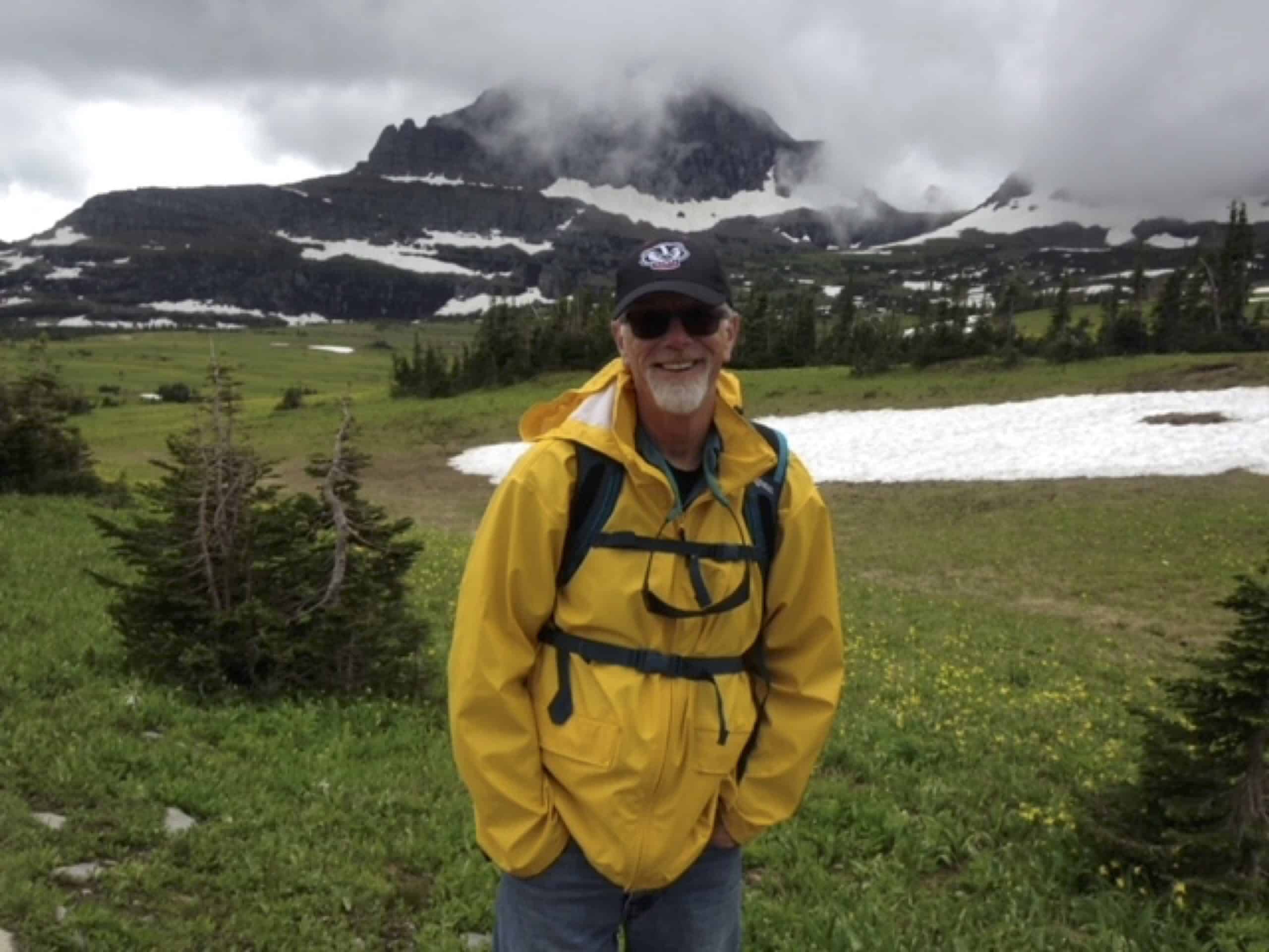 Dr. Jim Thorne posing with a mountain behind him