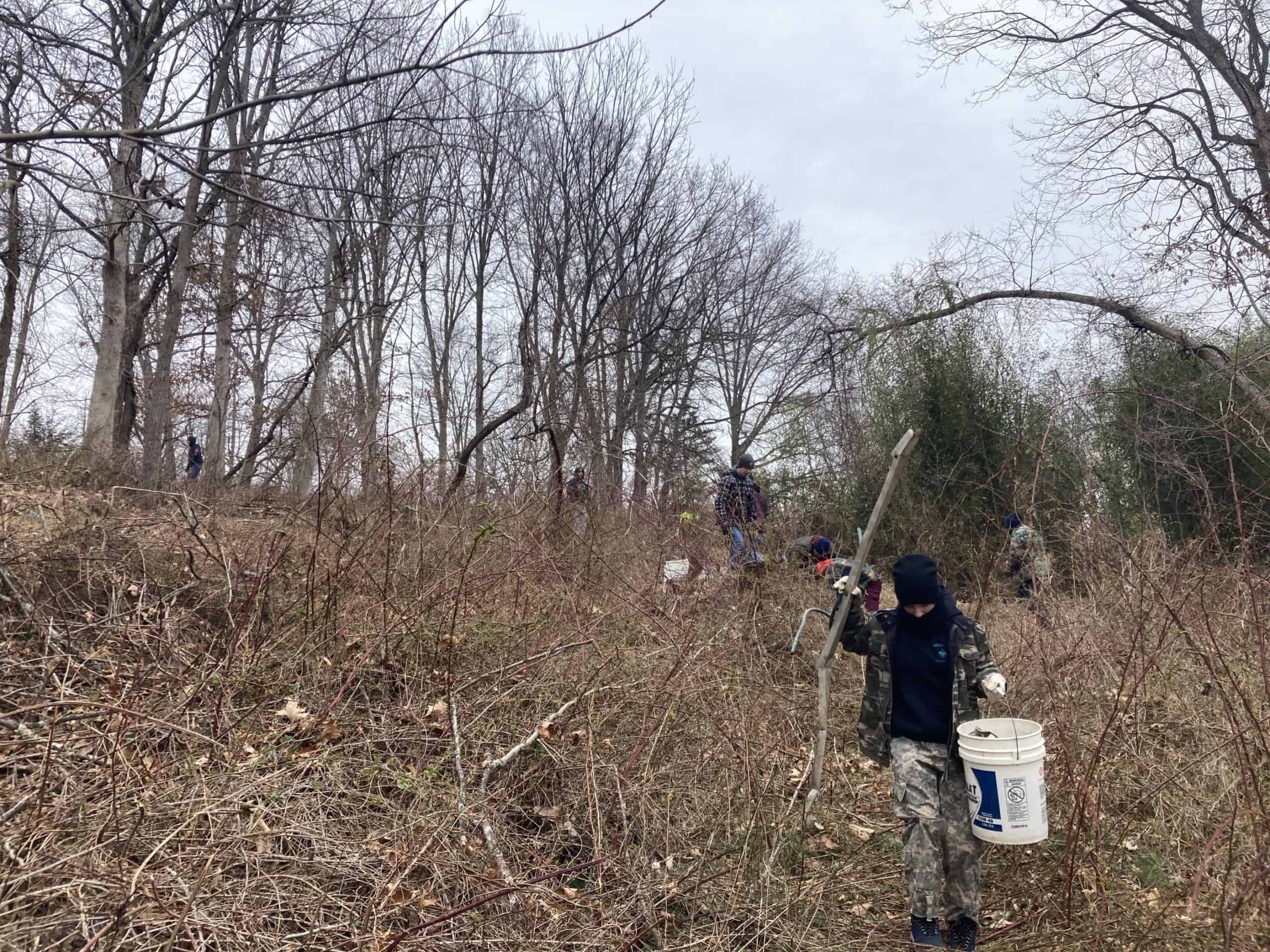 Scouts cleaning up trash at Crow's Nest Preserve