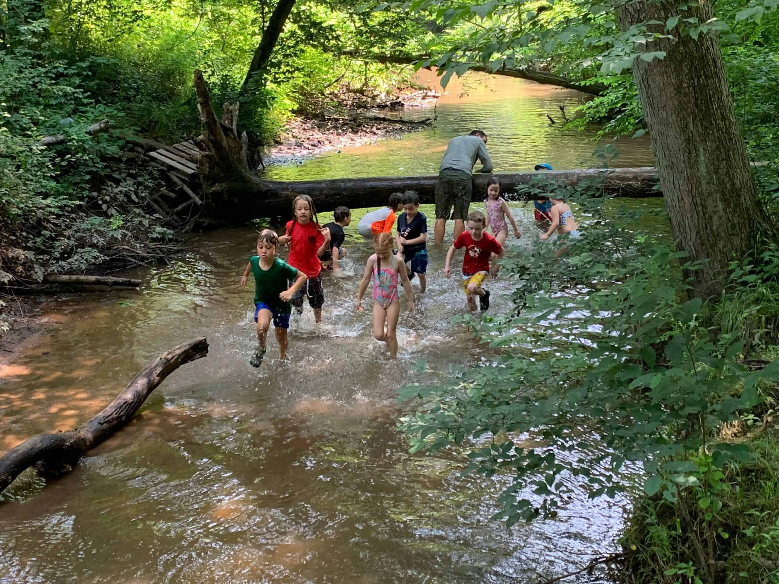 Kids running in a stream