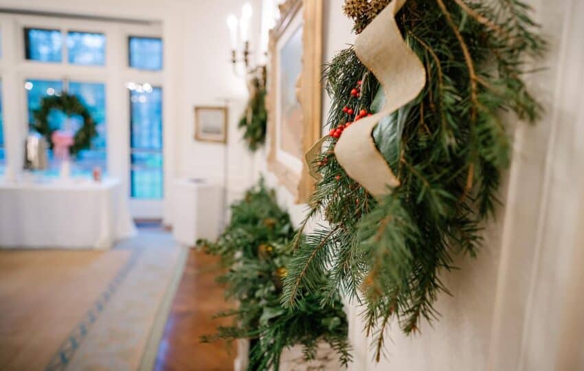 alt text: A closeup shot of a handmade wreath and holiday decor.