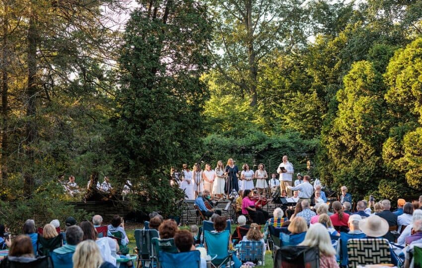 an outdoor performance in a sunny garden