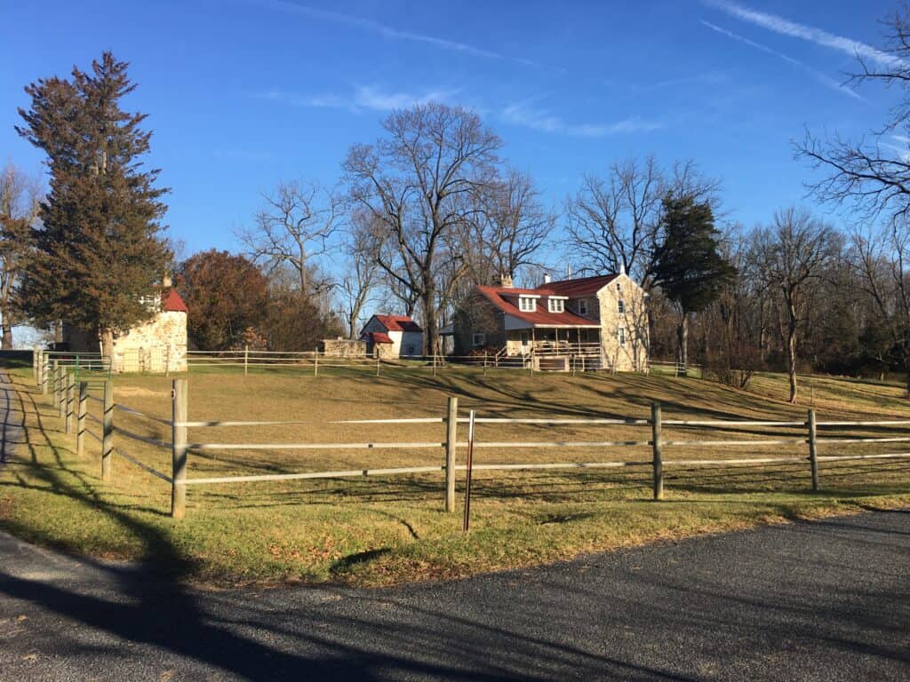 The stone farmhouse and outbuildings of the preserved Painter farmstead in Warwick Twp.