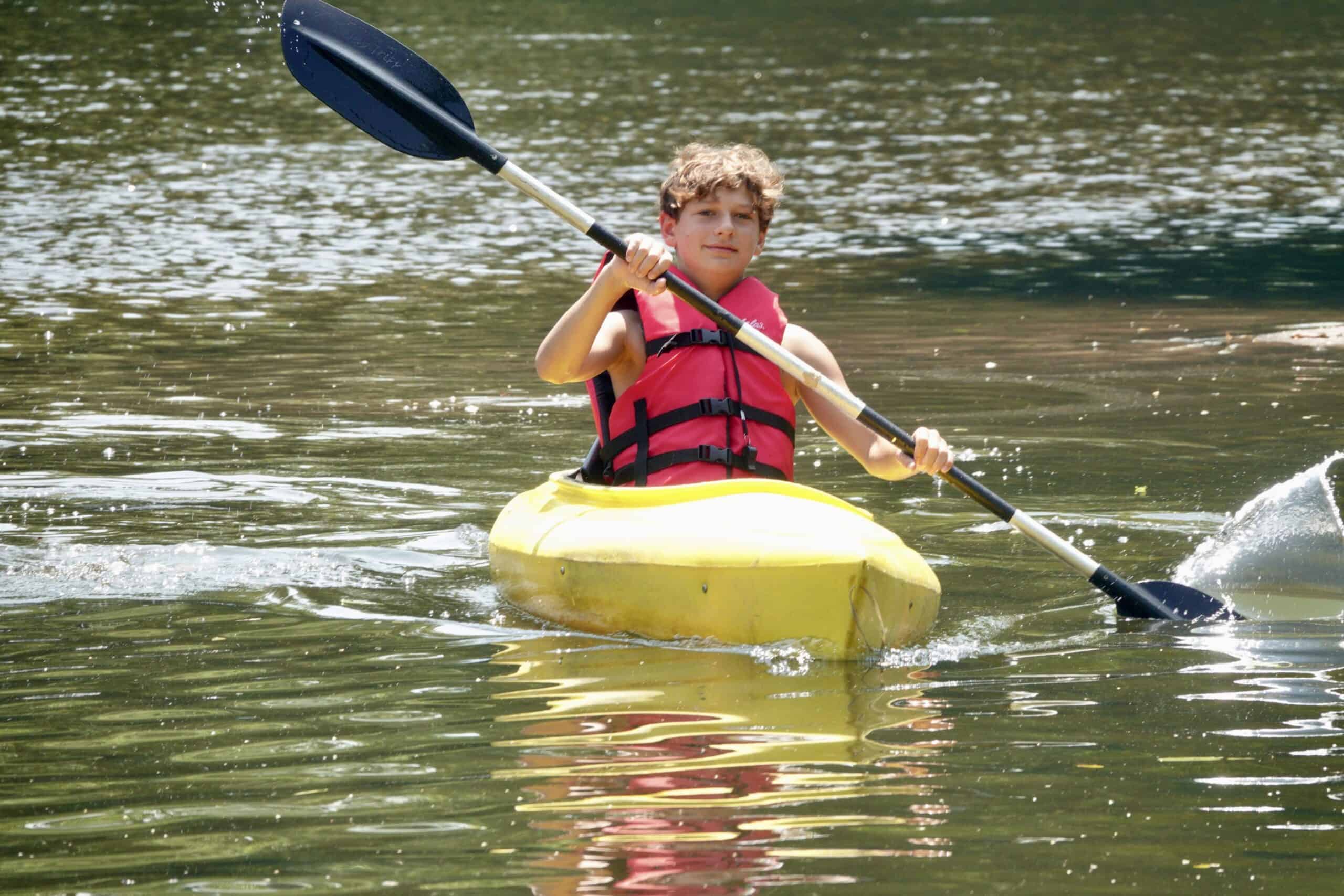 A Crow's Nest Camp kids in a kayak.