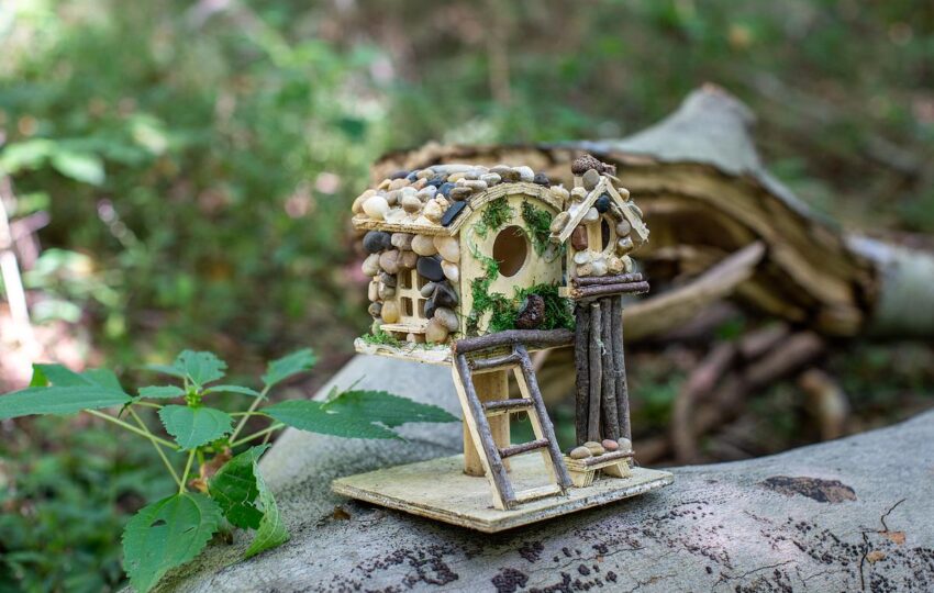 a miniature fairy house built out of natural materials